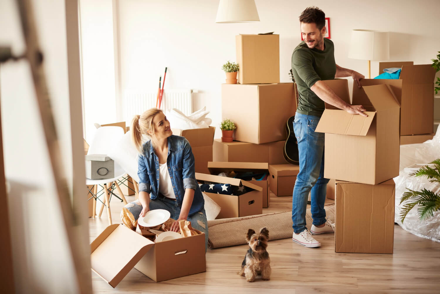 young-couple-new-apartment-with-small-dog (1) (1)